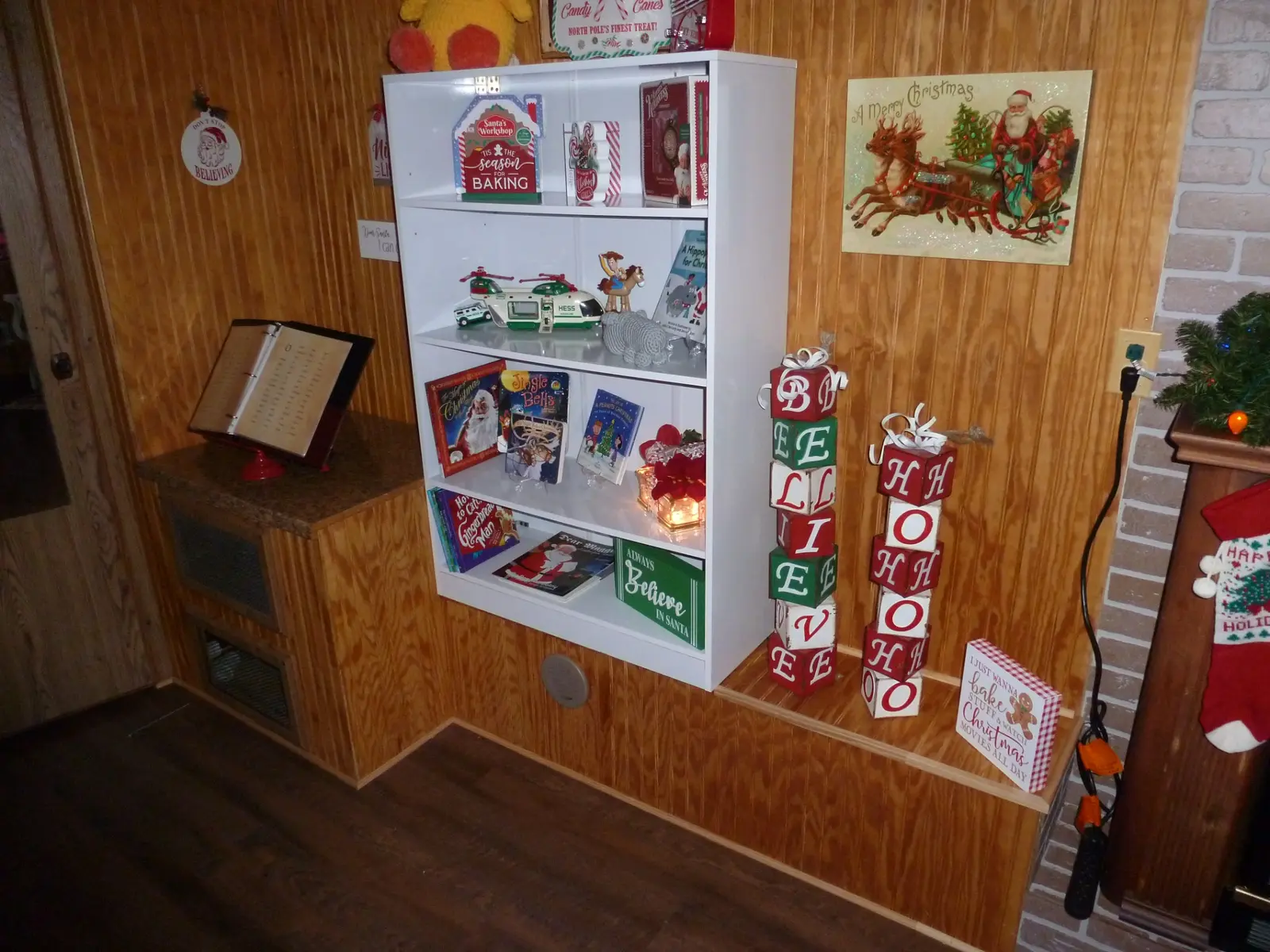 Christmas books, signs and decorations displayed inside Santa's Cabin