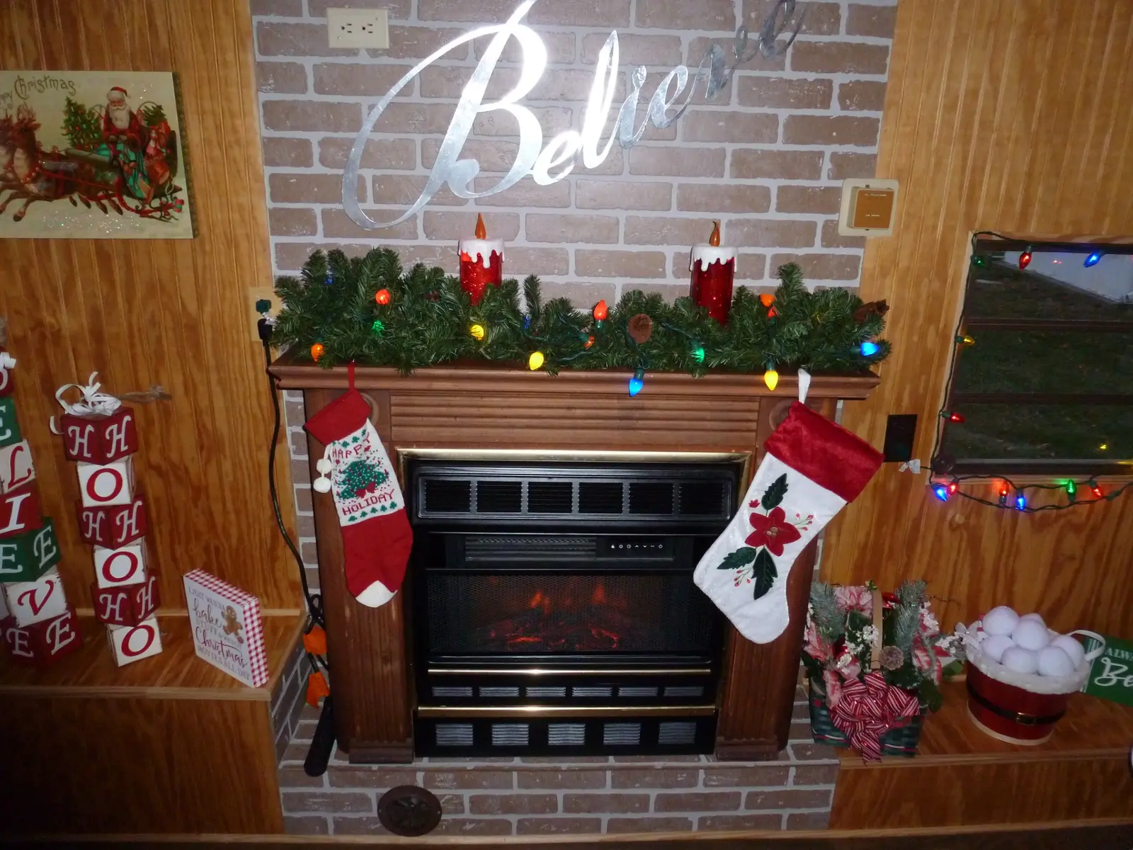 Close view of the decorated fireplace inside Santa's Cabin