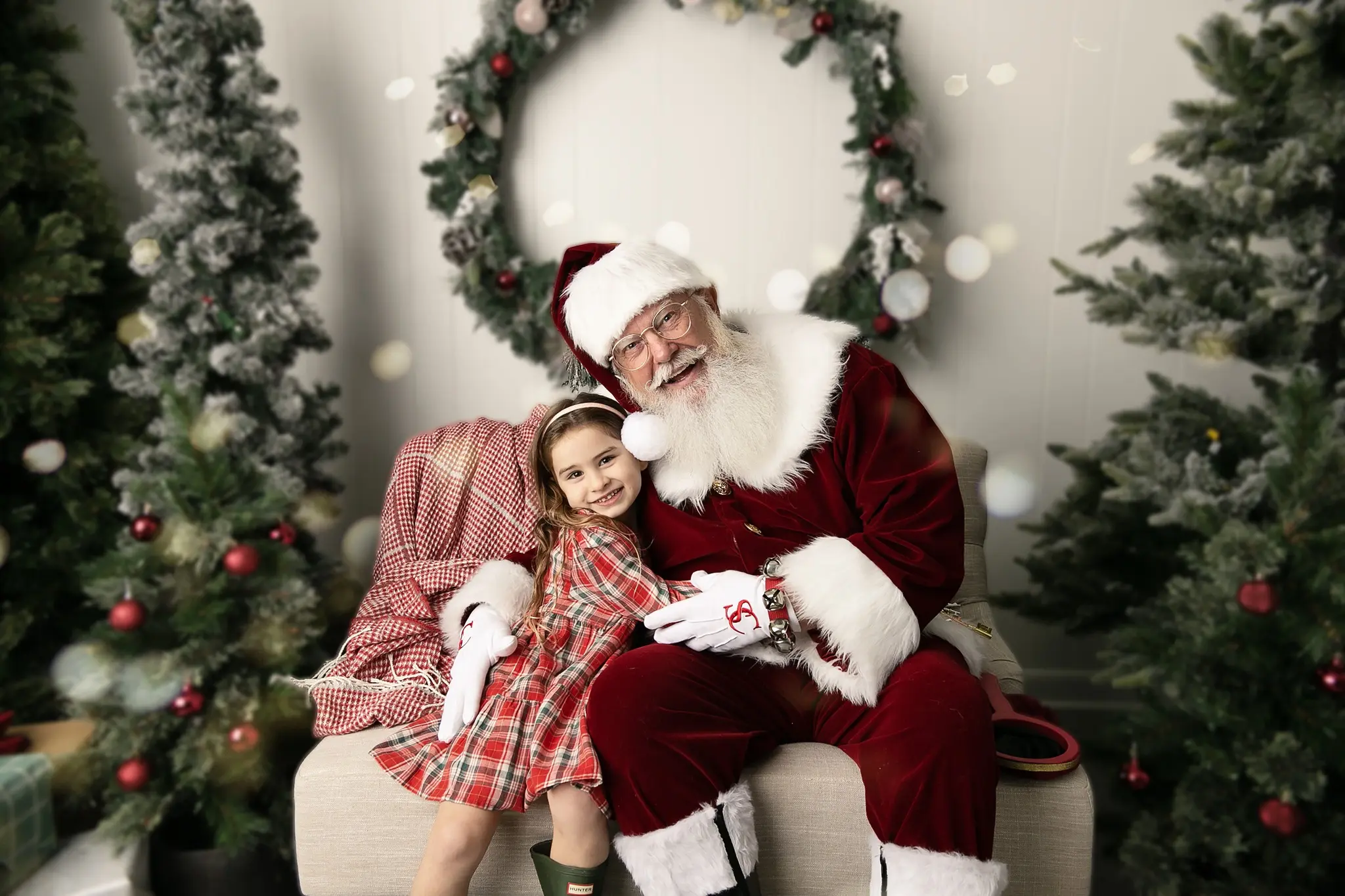 Santa Skip sharing a joyful Christmas portrait with a smiling child