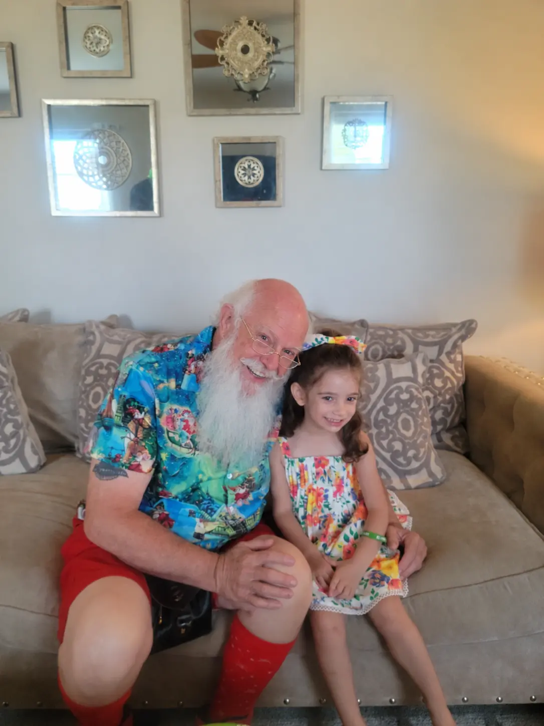 Santa Skip in summer clothes sharing a cheerful visit with children