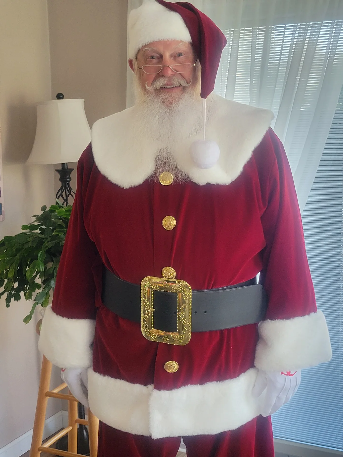 Santa Skip in a classic burgundy Santa suit